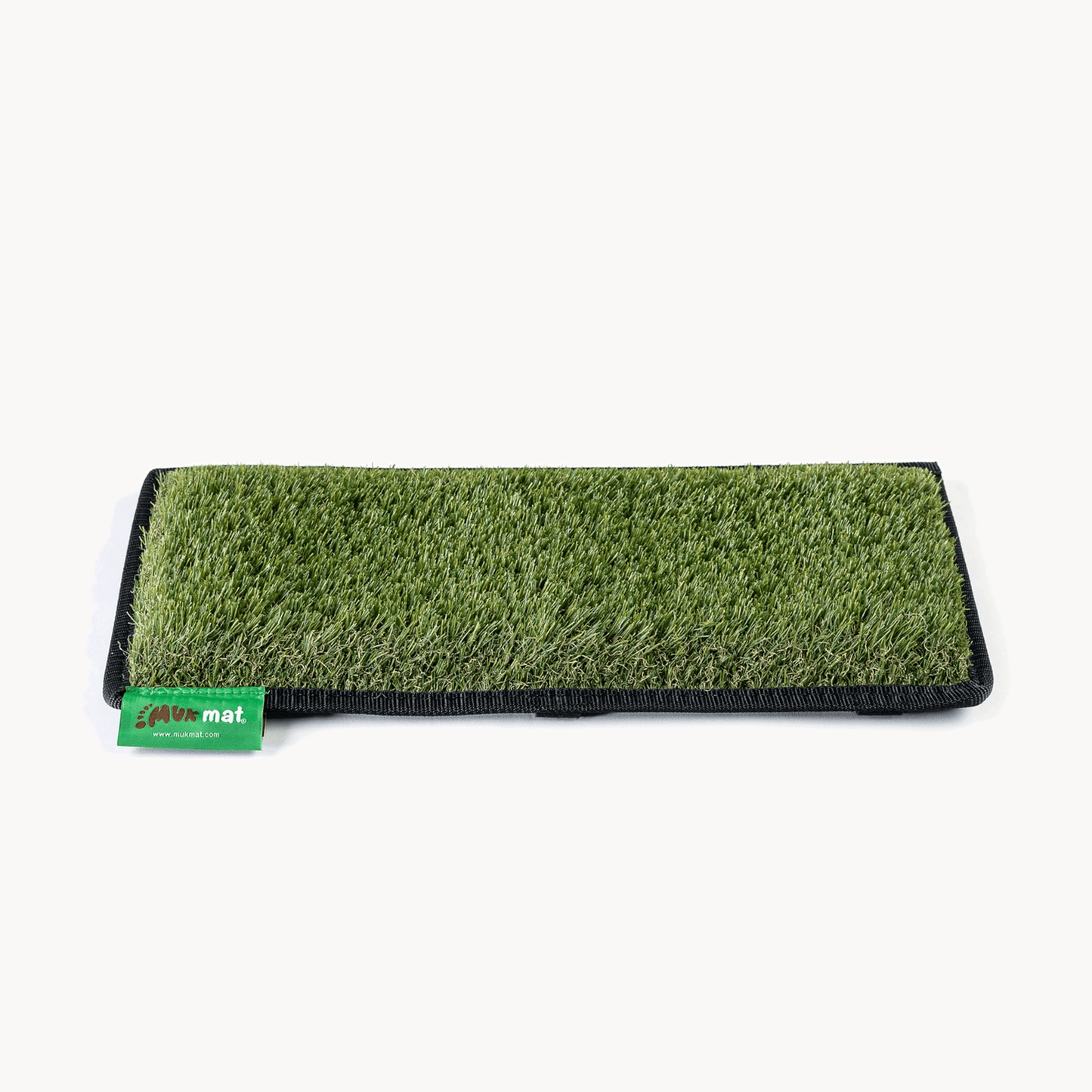 Muk Mat Pull-Out Step Green — synthetic grass mat designed for caravan pull-out steps
